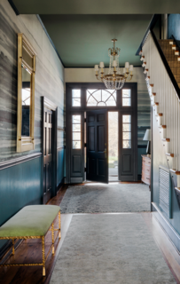 The walls throughout The Clifton were painted in Farrow & Ball’s Stone Blue, and the trim was gussied up with the complementary shade of Stiffkey Blue by Farrow & Ball.