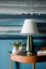 Modern home with Hallway. In the foyer, Phillip Jeffries’ tranquil blue Fade Sea Spray wallpaper gives a subtle nod to the nearby Blue Ridge Mountains, which guests have views of from the property. Photo 3 of The Clifton