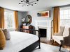 Modern home with Bedroom, Dresser, Ceiling Lighting, Chair, Medium Hardwood Floor, Bed, and Rug Floor. After a thoughtful remodel, a boutique hotel outside of Charlottesville, Virginia, is now inviting guests to embrace its luxurious dosage of Southern charm. There is no doubt The Clifton has had a fascinating past. Originally built in 1799, the historic 100-acre estate once belonged to Thomas Jefferson’s son-in-law, Thomas Mann Randolph Jr.
Husband to Jefferson’s oldest daughter, Martha, Randolph was a senator, delegate, and governor of Virginia, and used the land as an outpost for trade up and down the Rivanna River. Since the mid-1980s, the 1,850-square-foot historic building has operated as the acclaimed inn, The Clifton. Due to a recent change of ownership, the interiors have been beautifully revamped by Blackberry Farm Design to give the space a more contemporary aesthetic. Photo 10 of The Clifton