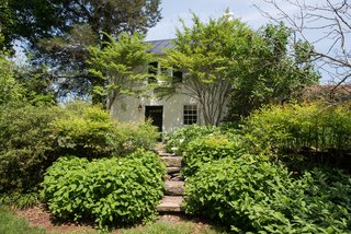 The neighboring garden cottage originally was Randolph’s law office. This space shares a garden with the old carriage house.