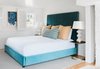 Modern home with Bedroom, Bed, Medium Hardwood Floor, and Rug Floor. Guest suites in the livery include cozy living areas and king-size beds that are upholstered in a rich turquoise velvet. Photo 16 of The Clifton