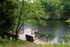 A stone’s throw from the main inn is the 20-acre Arabella Lake and the old livery, which is now outfitted with three guest suites that have private patios overlooking the water. Photo 15 of The Clifton modern home