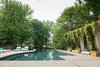 A quick walk from the inn and cottages, the infinity pool and cabanas offer a quiet place to sunbath and relax. Photo 17 of The Clifton modern home