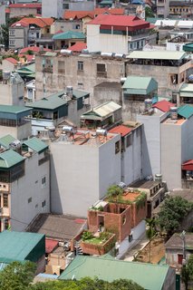 ODDO Architects designed a contemporary home for a family of four on a narrow, 4 meter by 16 meter plot of land in the dense city of Hanoi, Vietnam.