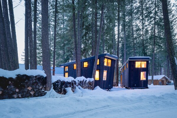 Located on the Chewuch River in northeast Washington, the wooded property is home to a two-room cabin, along with two 144-square-foot tiny homes.