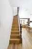 Modern home with Staircase, Wood Railing, and Wood Tread. Stairs from parlor floor to second floor, with original railing. Photo 5 of Sunset Park Row House