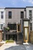 Modern home with Outdoor, Back Yard, Hardscapes, Small Patio, Porch, Deck, Wood Patio, Porch, Deck, and Vertical Fences, Wall. The rear facade. Photo 3 of Sunset Park Row House