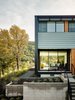 Modern home with Exterior, Flat RoofLine, Prefab Building Type, and Green Roof Material. The numerous sliding windows also provide the option of passive cooling and an open-air kitchen, living area, and dining area. Photo 3 of Orinda Connect 8+2