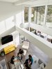 Modern home with Living Room, Floor Lighting, Coffee Tables, Sofa, Ceiling Lighting, Ottomans, Sectional, and Bench. 19' ceilings in the living room maximizing natural light to permeate the open spaces. Photo 4 of Orinda Connect 8+2