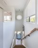Modern home with Staircase and Wood Railing. A George Nelson Bubble lamp hangs in the stairwell of Santa Monica Connect 4L. Photo 4 of Santa Monica Connect 4L