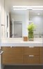 Modern home with Bath Room, Drop In Sink, Full Shower, Porcelain Tile Floor, Quartzite Counter, Recessed Lighting, Undermount Tub, Ceiling Lighting, Stone Slab Wall, and One Piece Toilet. Kids bathroom Photo 16 of White House