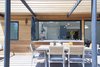 Modern home with Outdoor, Side Yard, Large Patio, Porch, Deck, Decking Patio, Porch, Deck, Wood Fences, Wall, Hardscapes, Wood Patio, Porch, Deck, and Hanging Lighting. Deck- sitting area connected to the great room Photo 17 of White House