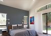 Modern home with Bedroom, Bed, Night Stands, Ceiling Lighting, Wall Lighting, and Vinyl Floor. Master suite Photo 14 of White House