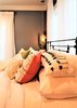 Modern home with Bedroom, Bed, Ceiling Lighting, Pendant Lighting, Accent Lighting, Medium Hardwood Floor, and Dark Hardwood Floor. Master Bedroom Bed Details Photo 18 of A 1920's English Cottage