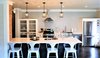 Modern home with Kitchen, Engineered Quartz Counter, Quartzite Counter, Colorful Cabinet, White Cabinet, Wood Cabinet, Medium Hardwood Floor, Dark Hardwood Floor, Ceramic Tile Backsplashe, Mosaic Tile Backsplashe, Porcelain Tile Backsplashe, Ceiling Lighting, Recessed Lighting, Accent Lighting, Pendant Lighting, Refrigerator, Dishwasher, Beverage Center, Range Hood, and Range. Overview of Kitchen Photo 13 of A 1920's English Cottage