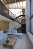 Modern home with Staircase, Metal Tread, and Metal Railing. The wedge permeates the roof as well, creating a skylight right above the metal stairway that leads down to the living room, kitchen and dining room Photo 10 of The Wedge House