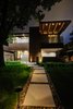 Modern home with Exterior, Flat RoofLine, House Building Type, Mid-Century Building Type, Green Roof Material, Wood Siding Material, Brick Siding Material, Stucco Siding Material, Metal Siding Material, and Concrete Siding Material. Front exterior Photo of Project 2575