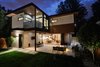 Modern home with Exterior, House Building Type, Mid-Century Building Type, Green Roof Material, Wood Siding Material, Brick Siding Material, Concrete Siding Material, Stucco Siding Material, Metal Siding Material, and Flat RoofLine. Back exterior highlights: seamless indoor/outdoor functionality on the bottom floor, master bedroom balcony Photo 2 of Project 2575