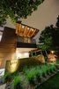 Modern home with Exterior, House Building Type, Green Roof Material, Mid-Century Building Type, Wood Siding Material, Brick Siding Material, Stucco Siding Material, Metal Siding Material, Concrete Siding Material, and Flat RoofLine. Front exterior highlight: jutting overhangs Photo 5 of Project 2575
