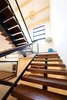 Modern home with Staircase, Wood Tread, Metal Railing, Glass Railing, and Wood Railing. Steel mono-stringer stair case Photo 14 of Project 2575