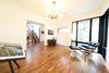 Modern home with Living Room, Chair, Ottomans, Media Cabinet, Lamps, Ceiling Lighting, and Medium Hardwood Floor. Lounge featuring original mid-century Eames® Lounge Chair and Ottoman Photo 15 of Project 2575