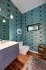 Modern home with Bath Room, Medium Hardwood Floor, Laminate Counter, Pendant Lighting, and One Piece Toilet. Powder Bathroom Photo 12 of Project 2575