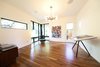 Modern home with Living Room, Chair, Ottomans, Media Cabinet, Ceiling Lighting, Medium Hardwood Floor, and Lamps. Lounge Photo 16 of Project 2575