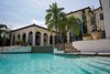 Modern home with Outdoor, Shrubs, Large Pools, Tubs, Shower, Trees, Large Patio, Porch, Deck, and Back Yard. Bathed in panoramic water views, the California-inspired outdoor living area epitomizes Isleworth lakefront living. Photo 2 of 5139 Fairway Oaks Drive