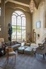 Modern home with Living Room, Chair, Lamps, End Tables, Sofa, Coffee Tables, and Ceiling Lighting. Living Area: The interior brings together exquisite details, including a magnificent stone fireplace, soaring cathedral window and captivating ceiling design in the living room. Photo 6 of 5139 Fairway Oaks Drive