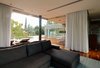 Modern home with Living Room, Sofa, Medium Hardwood Floor, and Ceiling Lighting. Living room and Pool area Photo 8 of House at Los Cisnes