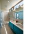 Side-by-side bedrooms for the children are connected through a ‘Jack & Jill’ bathroom. Photo 8 of Suburban Bungalow Grows Up modern home