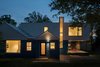 A carport and efficiency apartment on the first floor were removed to make way for a new addition containing a first-floor playroom and a partial second story.
Photo 19 of Suburban Bungalow Grows Up modern home