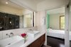 The Master Suite bath incorporates simple but rich natural materials. Photo 11 of Suburban Bungalow Grows Up modern home