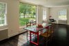 Interior blockages were removed on the first floor to create better flow between spaces. Photo of Suburban Bungalow Grows Up modern home