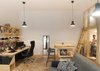 Modern home with Bookcase, Sofa, Pendant Lighting, Chair, Medium Hardwood Floor, Table, Bar, Desk, Shelves, Storage, Stools, Bedroom Room Type, Playroom Room Type, Living Room Room Type, Study Room Type, Shed & Studio, and Living Space Room Type. The Architecture Uncomfortable Workshop team crafted bespoke furniture to make the most of Bence’s small space and accommodate all of his hobbies and passions. Photo 2 of Micro live:work studio