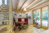 Modern home with Medium Hardwood Floor, White Cabinet, Wood Counter, Ceramic Tile Backsplashe, Pendant Lighting, Recessed Lighting, Dining Room, Chair, Table, and Lamps. All of the dining furniture is completely weatherproof and ready for action indoors in the kitchen or outdoors on the terrace, with a playful red and yellow palette chosen by the finally matriarch Photo 7 of A Family Affair