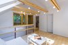 Modern home with Bedroom Room Type, Playroom Room Type, Living Room Room Type, Bed, Family Room Room Type, Medium Hardwood Floor, Coffee Tables, Sofa, Pendant Lighting, and Bedroom. The first floor is home to the kids’ rooms, a common area and a sheltered terrace Photo 9 of A Family Affair