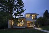 Modern home with Exterior, House Building Type, Stucco Siding Material, Metal Siding Material, Metal Roof Material, Curved RoofLine, and Glass Siding Material. Arch11-designed home at the base of Chautauqua Park in Boulder, CO Photo of 6th Street