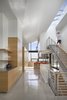 Modern home with Staircase, Metal Railing, Wood Tread, and Wood Railing. Minimalist design with views to every corner of the house. Vitra Hal stools in the kitchen from Design Within Reach Photo 6 of 6th Street