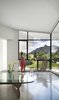 Modern home with Living Room, Concrete Floor, Coffee Tables, Chair, and Recessed Lighting. The changing mood of the Flatiron rock formation becomes the art on the wall Photo 9 of 6th Street