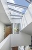Modern home with Hallway. skylights flood the home with natural light and accentuate its unique geometry Photo 10 of 6th Street