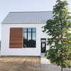 Modern home with Exterior, House Building Type, and Metal Roof Material. We took inspiration from modern, scandinavian, and farmhouse design to achieve our very own style. The simple "box" shape helped keep costs in check while the large windows, metal roof, and large ipe shutter created the perfect amount of interest. Photo of The Simply Simple Home