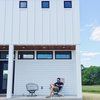 Modern home with Exterior, House Building Type, Wood Siding Material, and Metal Roof Material. The front porch features ipe shiplap siding which ties in nicely with the ipe shutter. Photo 2 of The Simply Simple Home