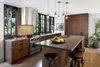 Modern home with Kitchen, Wood Cabinet, Pendant Lighting, Range Hood, Range, and Light Hardwood Floor. Brick House transformed Photo 2 of Brick House Transformed