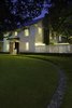 Modern home with Outdoor, Gardens, Wood Fences, Wall, Front Yard, Walkways, Landscape Lighting, Boulders, Wood Patio, Porch, Deck, Trees, Horizontal Fences, Wall, Grass, Metal Patio, Porch, Deck, Shrubs, Small Patio, Porch, Deck, and Concrete Patio, Porch, Deck. Front lawn and entry at Residence 1414 by Miró Rivera Architects Photo of Residence 1414