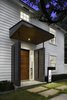 Modern home with Outdoor, Metal Patio, Porch, Deck, Walkways, Small Patio, Porch, Deck, Front Yard, Grass, Landscape Lighting, Wood Patio, Porch, Deck, Gardens, and Concrete Patio, Porch, Deck. Front door and mailbox at Residence 1414 by Miró Rivera Architects Photo 2 of Residence 1414