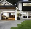 Modern home with Outdoor, Back Yard, Stone Patio, Porch, Deck, Large Patio, Porch, Deck, Hardscapes, Grass, and Landscape Lighting. Game room and patio at Residence 1414 by Miró Rivera Architects Photo 3 of Residence 1414