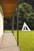 Modern home with Outdoor, Landscape Lighting, Trees, Walkways, Back Yard, Grass, Small Patio, Porch, Deck, and Stone Patio, Porch, Deck. Back yard and Sol Lewitt sculpture at Residence 1414 by Miró Rivera Architects Photo 13 of Residence 1414