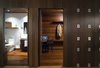 Modern home with Hallway and Dark Hardwood Floor. Guest quarters at Residence 1414 by Miró Rivera Architects Photo 15 of Residence 1414