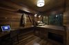 Modern home with Bedroom, Bed, Night Stands, Ceiling Lighting, Recessed Lighting, Pendant Lighting, Dark Hardwood Floor, Chair, and Shelves. Guest bedroom at Residence 1414 by Miró Rivera Architects Photo 16 of Residence 1414